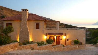 5. This stone-enclosed villa on the island of Crete in Greece is carved from natural rock and has a balcony that overlooks the Kissamos Bay.