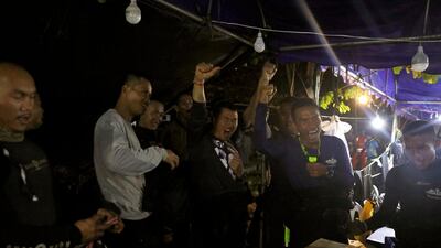 Thailand's Navy Seal celebrating near the Tham Luang cave complex, as members of under-16 soccer team and their coach have been found alive in the northern province of Chiang Rai, Thailand, on July 2, 2018. Soe Zeya Tun / Reuters
