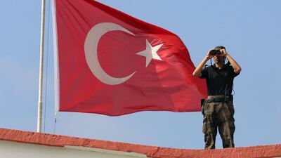 A member of a special Turkish security force secures the area during celebrations on the Victory Day in Ankara, Turkey. Burhan Ozbilici / AP Photo
