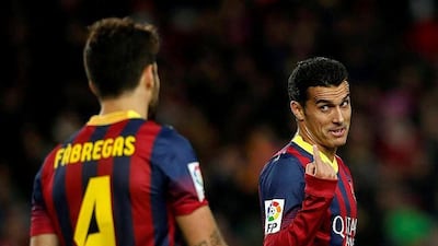 Barcelona goalscorers, Cesc Fabregas and Pedro, celebrate their 4-0 win against Granada. Albert Gea / Reuters