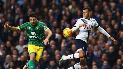 Dele Alli of Tottenham competes for the ball with Russell Martin of Norwich City during their Premier League match on Saturday. Matthew Lewis / Getty Images