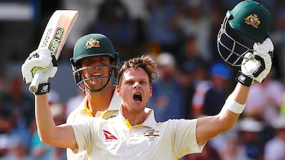 Australia captain Steve Smith celebrates with Mitchell Marsh after reaching his double century. David Gray / Reuters