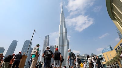 General view of the Burj Khalifa at Dubai Mall as tourists visit. Chris Whiteoak / The National