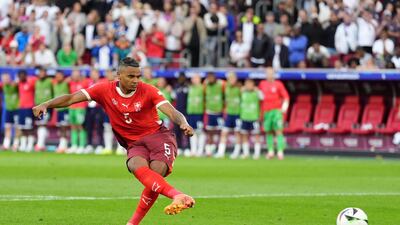 Manuel Akanji misses Switzerland's first penalty in the shoot-out. PA