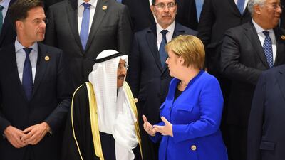 Germany's Chancellor Angela Merkel talks with Emir of Kuwait Sheikh Sabah Al Ahmad Al Sabah. AFP