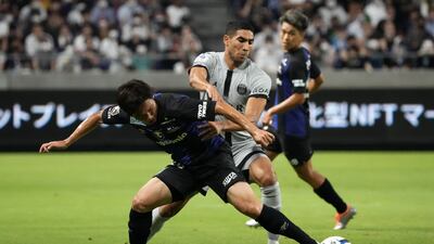 Keisuke Kurokawa of Gamba Osaka and PSG full-back Achraf Hakimi compete for the ball. Getty