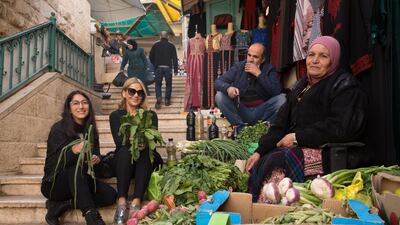 A photo of Lama Bazzari, centre, and Farrah Abuasad, left, during a trip to Palestine before publishing 'Craving Palestine'. Supplied