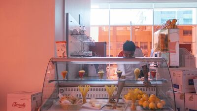 Biancorosso's windows are covered with a distinctive red tint. Mona Al Marzooqi / The National