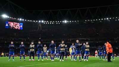 Porto players applaud their fans at full-time after defeat in the penalty shootout against Arsenal. Getty Images
