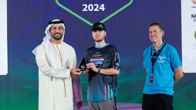 Sheikh Sultan awards the second runner up prize to British racer Luke Bannister, known as Banni UK
