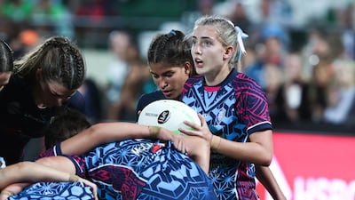 Dubai Warriors take on Dubai College during the Gulf Under-19 Girls final at the Emirates Dubai Sevens. Victor Besa / The National