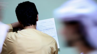 An Emirati student looking for a job during a career fair held at the Men’s Dubai College. A survey published this week by jobs website Bayt and YouGov showed most Emiratis still regard government jobs as more desirable. Paulo Vecina / The National