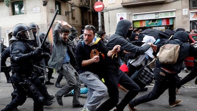 Demonstrators clash with police during a protest against Spain's cabinet meeting in Barcelona, Spain. REUTERS