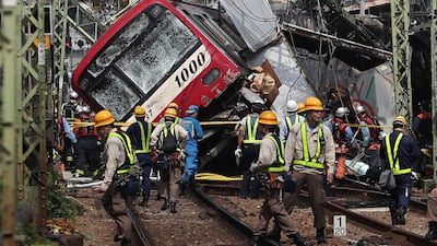 The Keikyu express train derailed and tilted. AFP