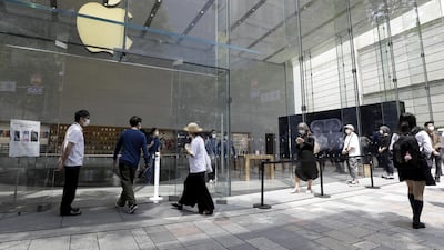 Customers line up in front of an Apple store in Tokyo last month. The tech giant is looking at ways its watch could be used to detect heart problems. Bloomberg