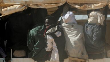 Refugees who fled the fighting in El Fasher, Sudan, are transferred by UN lorries from Tine to the Tuloum refugee camp, in eastern Chad. Reuters
