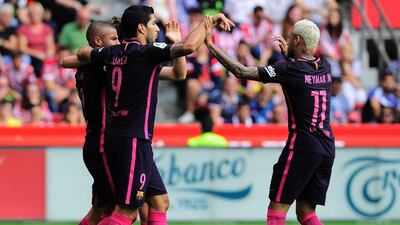 Barcelona midfielder Rafael Alcantara celebrates his goal with Luis Suarez and Neymar. Ander Gillenea / AFP