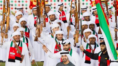 Sheikh Mohammed bin Zayed performs a traditional dance during the heritage celebrations titled "We are for homeland" part of the UAE's 41st National Day celebrations at the Abu Dhabi Equestrian Club. (Philip Cheung / Crown Prince Court - Abu Dhabi ).