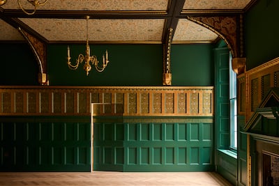 A hidden doorway in the dining room, which has the poem Earthly Paradise inscribed on its walls. Photo: Maison