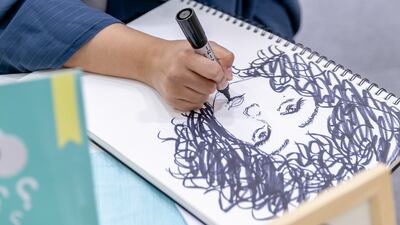 Sally Alhashmi paints familiar pop culture characters with Arabic phrases on almost any material she can find, from tote bags to T-shirts and canvases