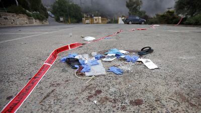 Medical gloves and material are seen lying on the floor in the Israeli settlement of Neve Ativ on June 23, 2015, at the scene where two wounded Syrians were attacked. Jalaa Marey/AFP Photo