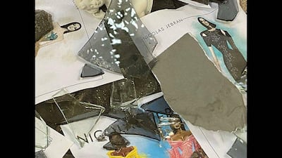 Sketches of Nicolas Jebran's designs for Cardi B and Megan Thee Stallion can be seen among broken glass and debris in the designer's Beirut atelier. Instagram / Nicolas Jebran