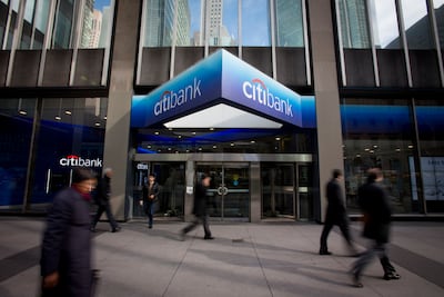 Pedestrians walking past a Citibank branch adjacent to Citigroup's headquarters in New York. Bloomberg via Getty Images