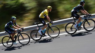 Great Britain’s Chris Froome (c), wearing the leader’s yellow jersey, rides during the 184.5km ninth stage of the 103rd Tour de France cycling race on July 10, 2016 between Vielha Val d’Aran and Andorre Arcalis. Jeff Pachoud / AFP