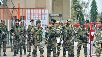 Indian security forces stand guard near the India-Pakistan border in Wagah on March 1, 2019, as they wait for the return of an Indian Air Force pilot being returned by Pakistan. Pakistan was set to free a captured Indian pilot on March 1 in a "peace gesture" aimed at lowering temperatures with its nuclear arch-rival, after rare aerial raids ignited fears of a dangerous conflict in South Asia. AFP