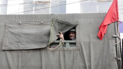 An Indian army soldier looks from a vehicle as they carry out a flag march during curfew in Jammu, the winter capital of Kashmir, India. EPA