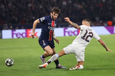 PSG winger Khvicha Kvaratskhelia rounds Aston Villa's Lucas Digne. EPA