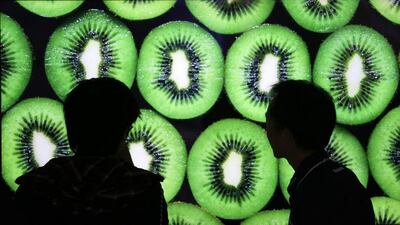 Visitors look at 4K LCD televisions. Jpanese manufacturers are launching models that can display the 4K picture – a resolution about four times that of standard high-definition TV. Kimimasa Mayama / EPA