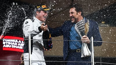 Actor Javier Bardem and Brad Pitt, actor playing Sonny Hayes, a driver of the fictional Apex APXGP F1 team in the upcoming 'F1' movie directed by Joseph Kosinski, are filming a scene on the podium during Formula 1 Abu Dhabi Grand Prix at Yas Marina Circuit. Getty Images