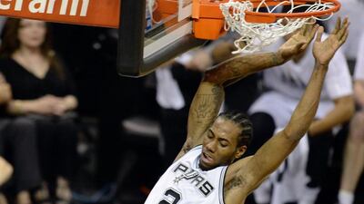 Kawhi Leonard's continued improvement is one factor that will help San Antonio stave off Father Time in 2014/15. Robyn Beck / AFP
