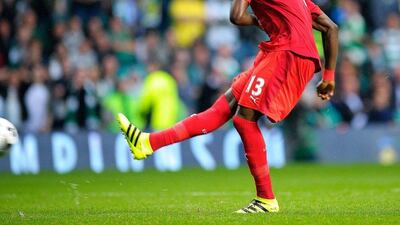 Leicester City midfielder Daniel Amartey scores the final penalty in the shoot-out during the International Champions Cup football match between Scottish Premiership champions Celtic and English Premier League champions Leicester City at Celtic Park in Glasgow, Scotland on July 23, 2016. Andy Buchanan / AFP