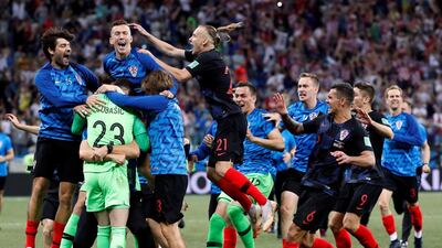 Players of Croatia celebrate after the round of 16 match between Croatia and Denmark. Croatia won the match after a penalty shootout. Etienne Laurent / EPA