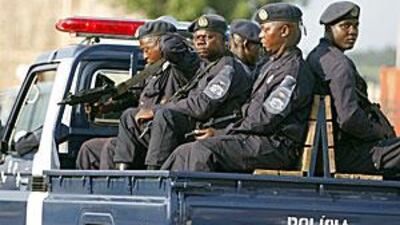 Armed Angolan police escort the bus carrying the Ghana players as it leaves the compound in Cabinda where team, who are in the same group as Togo were, are based.