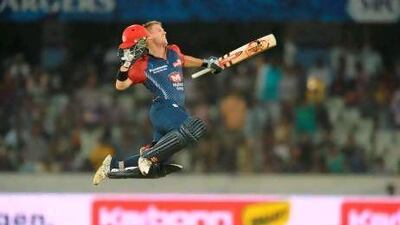 Delhi's David Warner leaps in to air after scoring his century against the Deccan Chargers last night. Noah Saleen / AFP