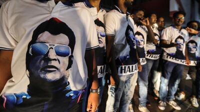 Fans of Rajinikanth wear t-shirts with his portrait as they celebrate the release of his long-awaited film "2.0" in Mumbai, India. EPA