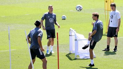 Left to right: Emre Can, Toni Kroos, Thomas Müller and Joachim Low. Getty