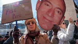 Amazon's tech layoffs also coincided with restructuring at Jeff Bezos-owned Washington Post. Residents who read the Post join members of the guild to protest during a rally outside the newspaper's offices. AFP