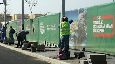 A road crew works outside the Formula One corniche circuit, in Jiddah, Saudi Arabia. The F1 race, which will take place from Dec. 3-5, will be the first time Saudi Arabia hosts the premier sporting event. AP Photo