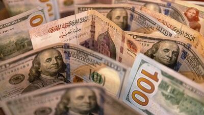 The Egyptian pound continues to slide against the US dollar, with analysts predicting further devaluation as Cairo seeks to meet a key requirement for an International Monetary Fund loan. AFP