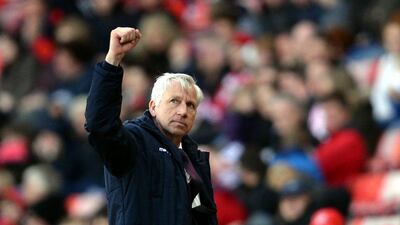 Manager Alan Pardew of Crystal Palace pumps his fist after their Premier League win over Sunderland on Saturday. Nigel Roddis / Getty Images / April 11, 2015