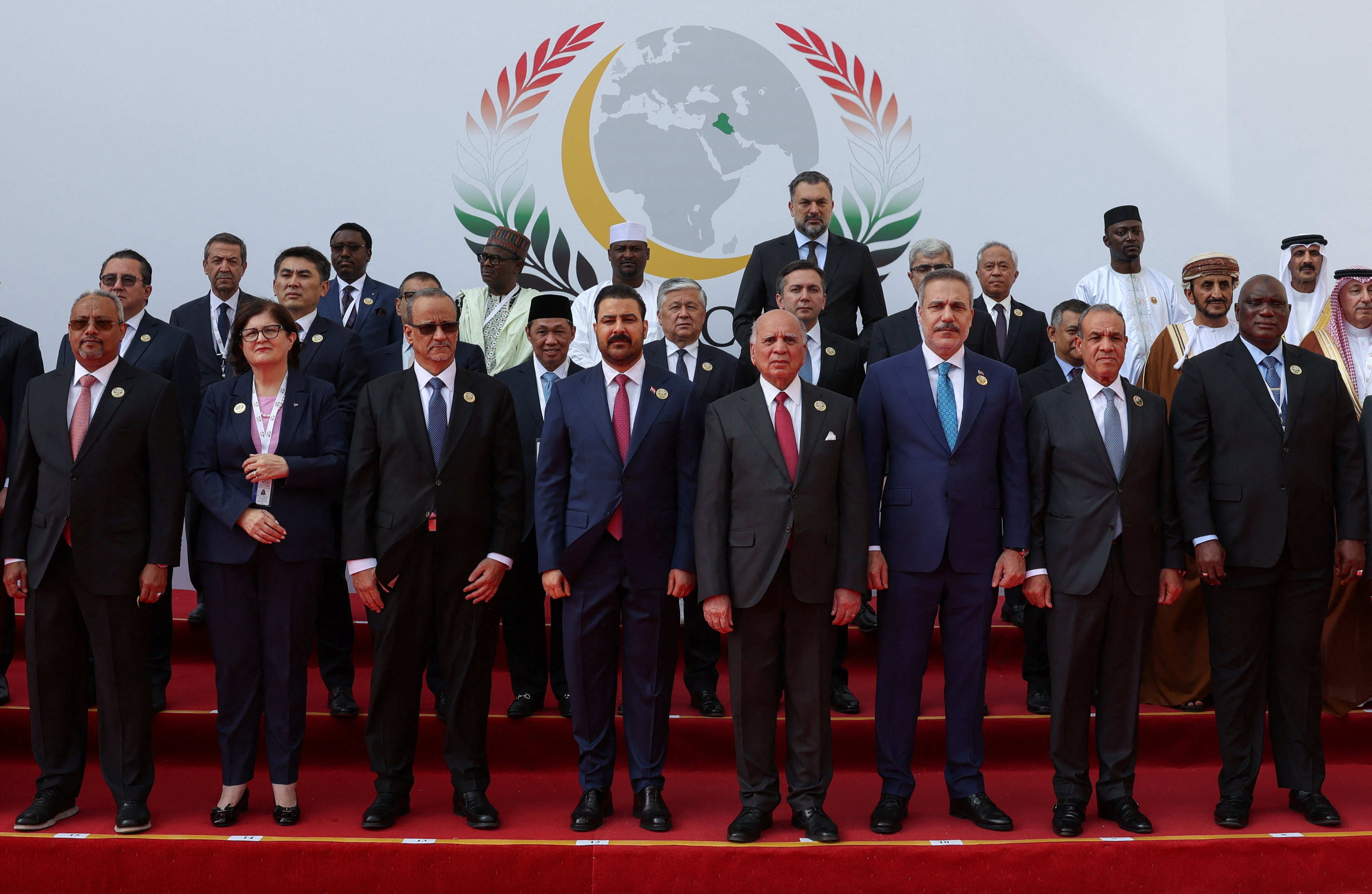 Iraq's Prime Minister Ali Al Zaidi, centre, hosted representatives of Islamic countries at an OIC meeting in Baghdad. Reuters