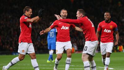 Wayne Rooney, No 10, of Manchester United celebrates with his team-mates after Inigo Martinez of Real Sociedad scored an own goal during their Uefa Champions League match on Wednesday. Alex Livesey / Getty Images