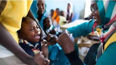 A Sudanese child receiving a vaccination against the meningitis at the community center in Al Neem camp for Internally Displaced People in el-Dain, East Darfur.