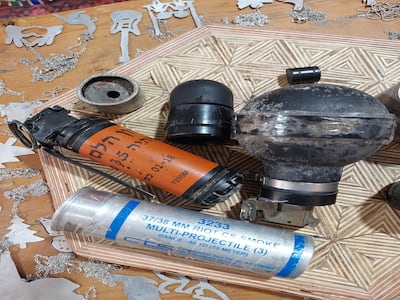 Foam-tipped bullets, tear gas and smoke bombs are turned into jewellery. Sarah Maisey / The National