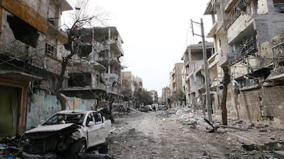 Damaged cars and buildings are seen in the besieged town of Douma, Eastern Ghouta, Damascus, Syria on February 25, 2018. Bassam Khabieh / Reuters