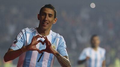 Argentina's Angel Di Maria celebrates after scoring one of his two goals in the Copa America semi-final victory over Paraguay on Tuesday night. Silvia Izquierdo / AP / June 30, 2015